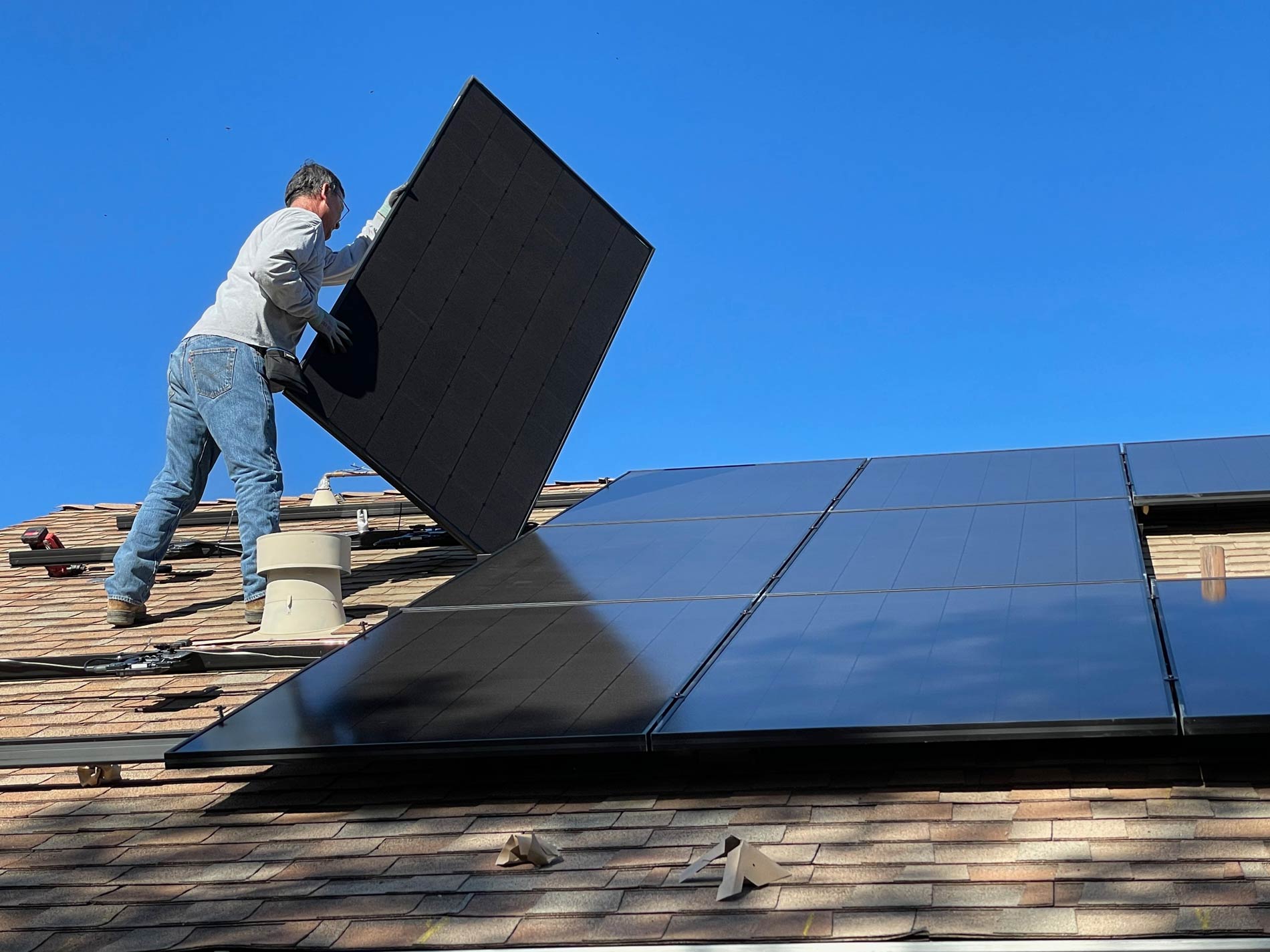 PES Renewables installing Solar Panels on roof