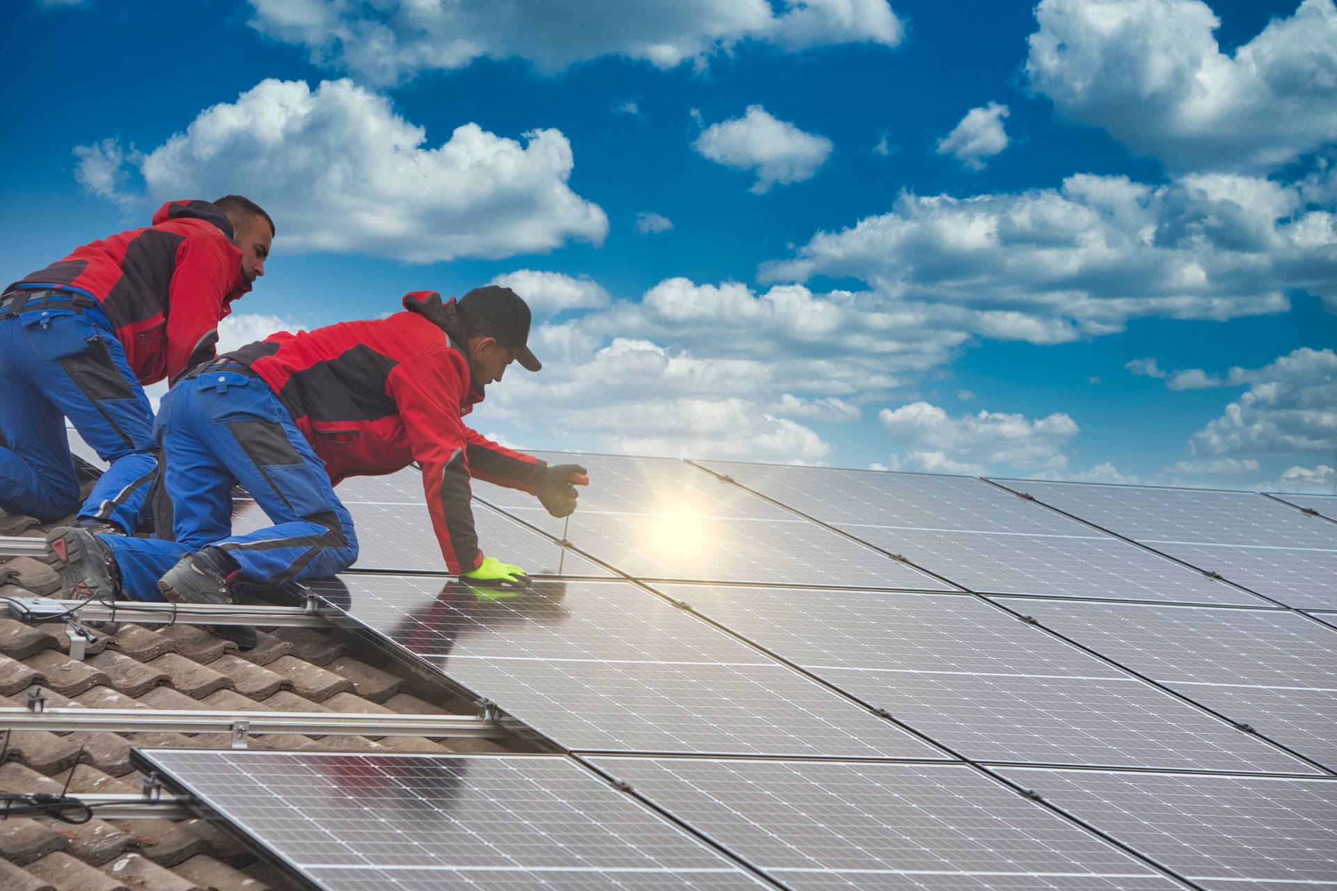 PES Renewables team installing Solar Panels on roof